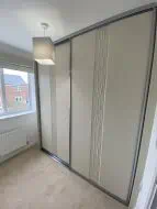 Sahara design wrapped sliding wardrobe in mussel with gun metal frames, fitted in Ingleby Barwick